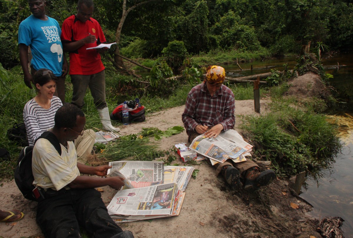 Pressing plants in the field.